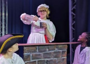 Daphne the Barmaid serves her loyal patrons whilst telling stories of old