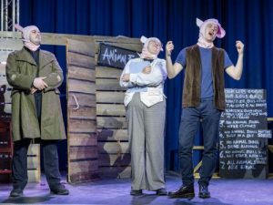 Minimus recites his poem, Napoleon and Squaler look on with pride - Animal Farm 2026 - Lewes Drama Collective
